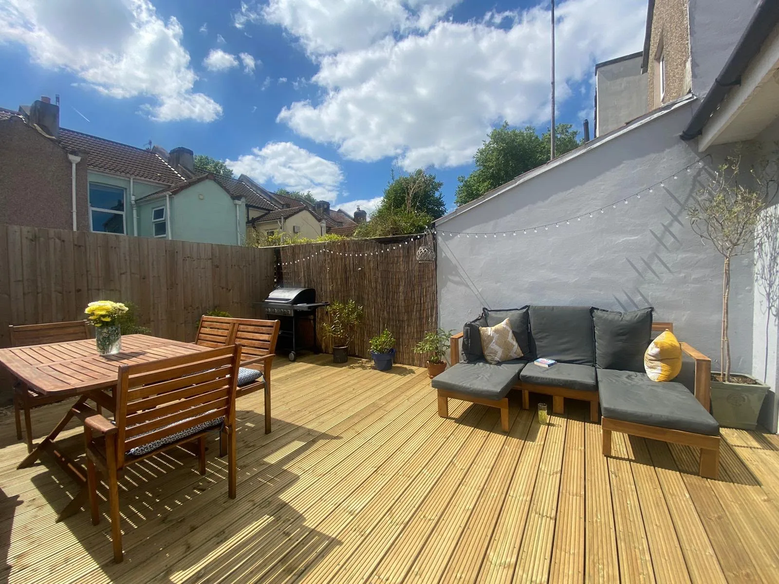 Raised timber decking with matching fence in a Bedminster garden